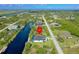Aerial view of waterfront property with canal access, marked with a location pin at 10454 Atenia St, Port Charlotte, FL 33981