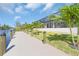 A new waterfront dock complemented by manicured greenery, perfect for relaxing by the water at 10454 Atenia St, Port Charlotte, FL 33981