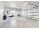 Spacious and clean two car garage with concrete flooring and bright lighting at 10454 Atenia St, Port Charlotte, FL 33981