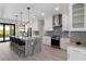 Bright kitchen features white cabinets, marble countertops, and stainless steel appliances at 10454 Atenia St, Port Charlotte, FL 33981