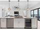 Kitchen island features a stainless steel dishwasher and wine cooler at 10454 Atenia St, Port Charlotte, FL 33981
