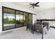 A stylish covered patio extending from the living space through sliding doors, enhancing seamless indoor-outdoor living at 10454 Atenia St, Port Charlotte, FL 33981