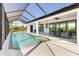 Inviting pool and patio area with ample seating, ideal for enjoying the Florida lifestyle at 10454 Atenia St, Port Charlotte, FL 33981