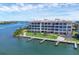 Waterfront condo building with private docks, lush landscaping, and breathtaking water views at 11100 Hacienda Del Mar Blvd # G-304, Placida, FL 33946