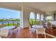 Inviting outdoor patio with tables, chairs, and picturesque waterfront views at 11100 Hacienda Del Mar Blvd # G-304, Placida, FL 33946
