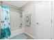 Bathroom highlighting a tiled shower/tub combination, a shower curtain and fresh towels nearby at 1247 Nora Ln, North Port, FL 34286