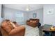Comfortable living room with a ceiling fan, neutral walls and modern flooring at 1247 Nora Ln, North Port, FL 34286