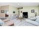 Spacious living room with comfortable seating and light-colored walls at 1247 Nora Ln, North Port, FL 34286