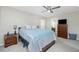 Well-lit main bedroom with a ceiling fan and furnishings, features neutral walls and carpet at 1247 Nora Ln, North Port, FL 34286
