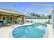 Beautiful screened-in pool with outdoor dining, covered patio and comfortable lounge chairs at 1247 Nora Ln, North Port, FL 34286