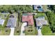 Aerial view showcasing the layout of the property and its proximity to neighboring homes and driveways at 13080 Proctor Ave, Port Charlotte, FL 33981