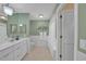 Clean bathroom with white vanity, tile floors, and a shower tub combination at 13080 Proctor Ave, Port Charlotte, FL 33981