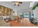 Open living area with seamless access to a covered patio and pool through large sliding glass doors at 13080 Proctor Ave, Port Charlotte, FL 33981