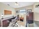 Functional home office featuring a large desk, comfortable chair, and ample storage space at 13080 Proctor Ave, Port Charlotte, FL 33981