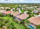 Beautiful aerial view of homes, mature landscaping, and water features in this desirable neighborhood at 13282 Scrub Jay Ct, Port Charlotte, FL 33953
