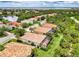 Enjoy the view of this beautiful home with a private screened-in pool and lush landscaping at 13282 Scrub Jay Ct, Port Charlotte, FL 33953