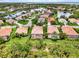 Discover this home featuring a tranquil lake view, complemented by lush landscaping and a screened lanai at 13282 Scrub Jay Ct, Port Charlotte, FL 33953