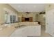Open kitchen overlooking Gathering room offers bar seating and plentiful natural light at 13282 Scrub Jay Ct, Port Charlotte, FL 33953