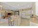 Open concept kitchen with bar stool seating area opens to Gathering room at 13282 Scrub Jay Ct, Port Charlotte, FL 33953