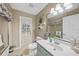 Bathroom with vanity, toilet and glass enclosed shower with shower curtain at 13703 Drysdale Ave, Port Charlotte, FL 33981