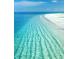 Stunning beach scene with clear turquoise water and white sand at 13703 Drysdale Ave, Port Charlotte, FL 33981