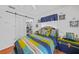 Bright bedroom with a ceiling fan, closet, and light coming from window at 13703 Drysdale Ave, Port Charlotte, FL 33981