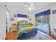 Bedroom with ceiling fan, sliding doors to pool area, and accent decor at 13703 Drysdale Ave, Port Charlotte, FL 33981