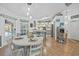 Open dining area flowing into a well-equipped kitchen with a breakfast bar and stylish decor and view of the pool at 13703 Drysdale Ave, Port Charlotte, FL 33981