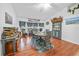 Cozy dining room with wood floors, stylish decor, and a charming breakfast nook with windows at 13703 Drysdale Ave, Port Charlotte, FL 33981