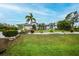 Charming home with a beautifully landscaped front yard, complete with a fountain and vibrant flowers at 13703 Drysdale Ave, Port Charlotte, FL 33981