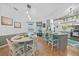 Open kitchen and dining area with stylish decor, a breakfast bar and a view of the pool at 13703 Drysdale Ave, Port Charlotte, FL 33981