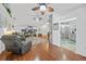 Open-concept living area with hardwood floors and comfortable furnishings at 13703 Drysdale Ave, Port Charlotte, FL 33981