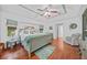 Comfortable main bedroom with tray ceilings, ensuite bathroom, and natural light at 13703 Drysdale Ave, Port Charlotte, FL 33981