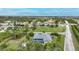 Above aerial view of a residence with a large screened-in pool at 13703 Drysdale Ave, Port Charlotte, FL 33981