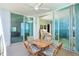 Covered outdoor balcony with seating, perfect for entertaining and enjoying the waterfront views at 1375 Beach Rd # 201, Englewood, FL 34223