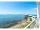 Balcony overlooking waterfront view with nearby bridge and blue skies at 1375 Beach Rd # 201, Englewood, FL 34223