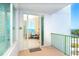 Balcony entryway view showcases bright interiors and waterfront vistas at 1375 Beach Rd # 201, Englewood, FL 34223