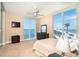 Bright bedroom features waterfront views from large windows and neutral colors at 1375 Beach Rd # 201, Englewood, FL 34223