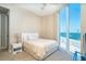 Bright bedroom features waterfront views and a calming color palette at 1375 Beach Rd # 201, Englewood, FL 34223