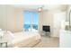 Bedroom features waterfront view from window, and neutral colored decor at 1375 Beach Rd # 201, Englewood, FL 34223