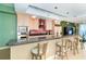 Kitchen featuring granite countertops, stainless steel appliances, and a breakfast bar with seating at 1375 Beach Rd # 201, Englewood, FL 34223