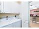 Laundry room featuring a white side-by-side washer and dryer at 1375 Beach Rd # 201, Englewood, FL 34223