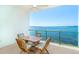 Outdoor patio features a table and chairs with beautiful views of the water at 1375 Beach Rd # 201, Englewood, FL 34223