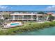 Waterfront condo community features a pool, tropical landscaping and scenic bay views at 1501 Beach Rd # 310, Englewood, FL 34223
