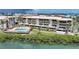 Aerial view of condo community and pool with water view at 1501 Beach Rd # 310, Englewood, FL 34223