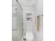 Shower and toilet with glass doors and white tile at 1501 Beach Rd # 310, Englewood, FL 34223