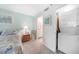 Cozy bedroom with a comfortable bed, a nightstand, and access to an ensuite bathroom and laundry at 1501 Beach Rd # 310, Englewood, FL 34223