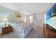 Relaxing bedroom with beach view on TV, and access to adjacent bathroom and closets at 1501 Beach Rd # 310, Englewood, FL 34223