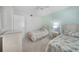 Bright second bedroom features two twin beds and a beach-themed decor at 1501 Beach Rd # 310, Englewood, FL 34223