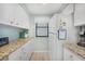 Efficient kitchen featuring ample counter space, modern appliances, and plenty of storage at 1501 Beach Rd # 310, Englewood, FL 34223